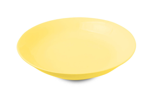 Yellow plate isolated on white background. - Photo, Image