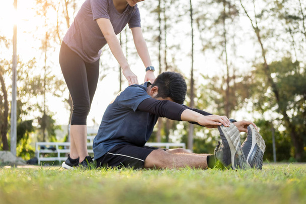 Early morning workout, Fitness couple stretching outdoors in par - Foto, immagini