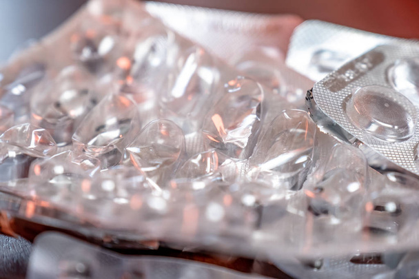 Empty blister packaging of medicine pills on wooden table - 写真・画像