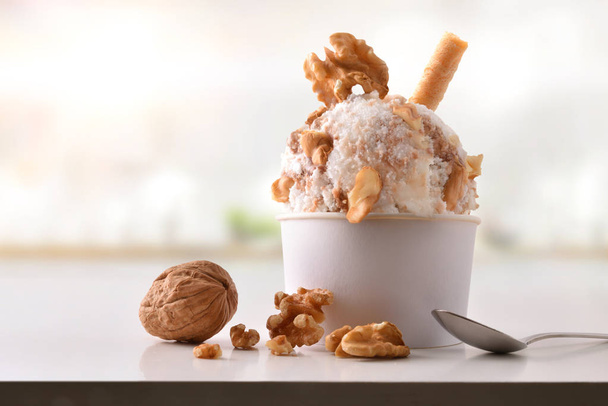 Walnuts ice cream cup on white table homemade in kitchen - Foto, Imagen