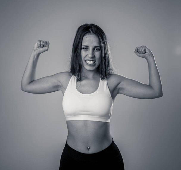 Beauty portrait of sport confident young woman wearing gym top looking sensual and fit. Studio shot of cheerful latin strong woman in sportswear looking healthy and sexy. In fitness Body care concept. - Φωτογραφία, εικόνα