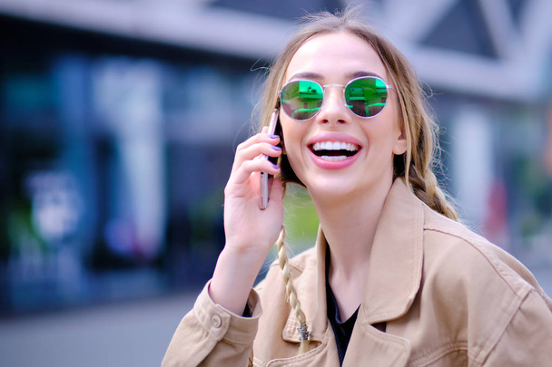 Young woman talking on mobile phone  - Photo, Image