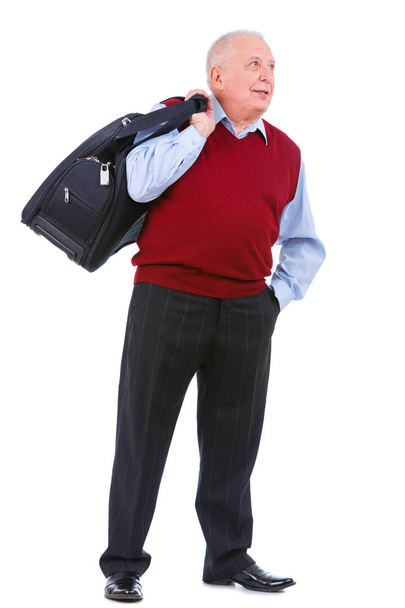Happy and smile old senior man holding suitcase on shoulder and put hand in trouser pocket looking at right, isolated on white background. Positive human emotion, facial expression - Photo, image