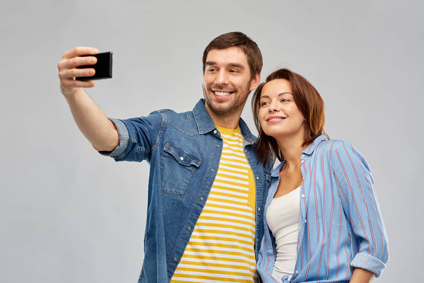 happy couple taking selfie by smartphone - Photo, Image