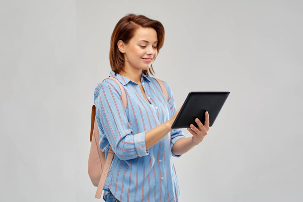 happy woman with backpack and tablet computer - Фото, изображение