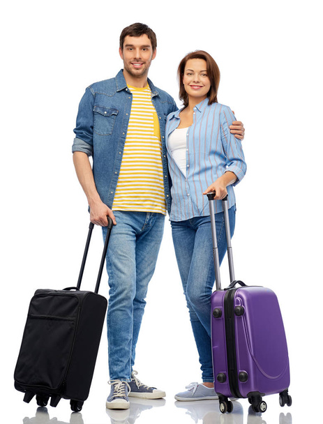 happy couple of tourists with travel bags - Zdjęcie, obraz