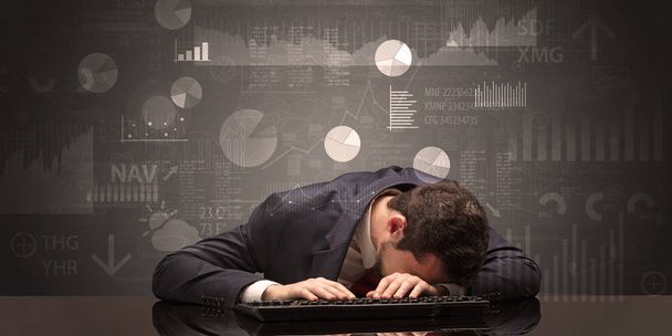 Businessman sleeping with charts, graphs and reports concept - Foto, immagini