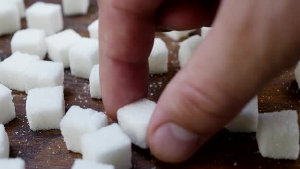 Lumps of Sugar Taken from Wooden Table - Footage, Video