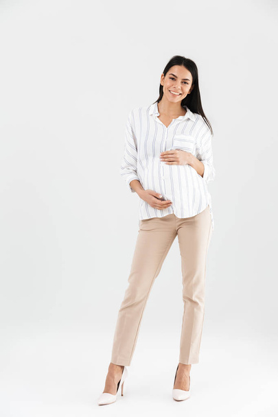 Full length photo of caucasian pregnant businesswoman 30s smilin - Foto, Imagem