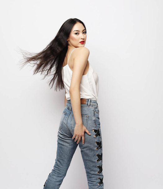 lifestyle and people concept - beautiful young asian woman with long hair posing in casual clothes - Fotografie, Obrázek