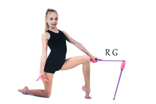 Teenager girl gymnast holds in hands clubs for rhythmic gymnastics - Foto, immagini