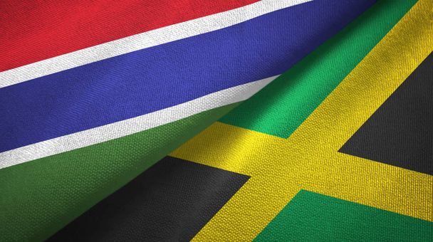 Gambia i Jamajka dwie flagi tkanina tekstylna, tekstura tkaniny - Zdjęcie, obraz