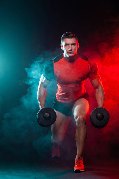 Muscular fitness sports man, atlete with dumbbell in fitness gym. Energy and power. - Foto, Imagem