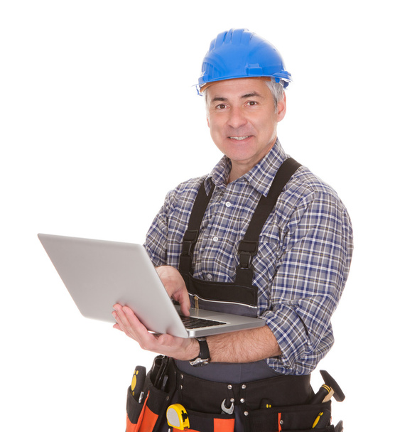 Technician Holding Laptop - Foto, imagen