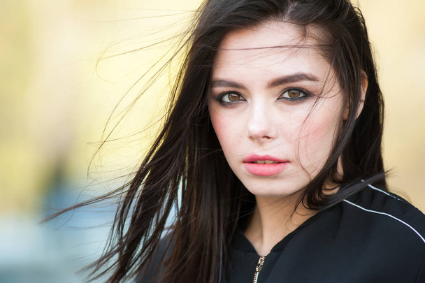 Beautiful young woman portrait on the wind - Photo, Image