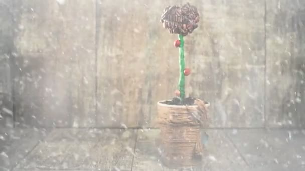 fiocchi di neve su albero del caffè su sfondo di legno
 - Filmati, video