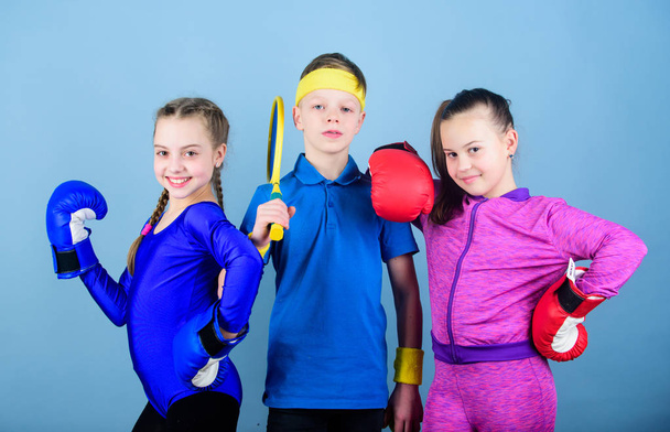 Ready to fight. Team sport success. workout of small girls boxer and boy in sportswear. Happy children in boxing gloves with tennis racket and ball. Fitness energy health. punching knockout - Valokuva, kuva