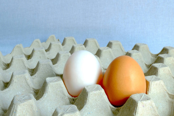 Chicken egg and duck egg place on paper tray - Photo, Image