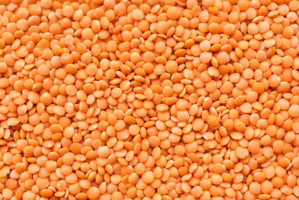 Background with a lot of red lentils. - Photo, Image