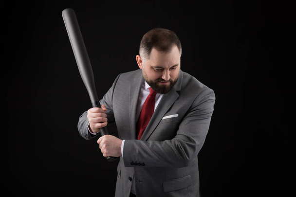 bearded Man in suit and red tie with baseball bat - Foto, afbeelding