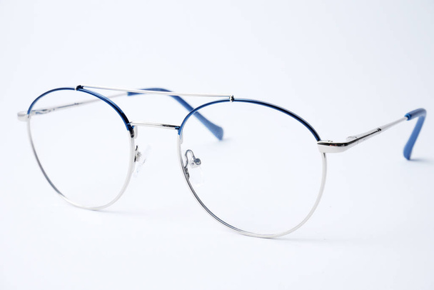 Round glasses for sight with silver metal frame. - Foto, Imagen