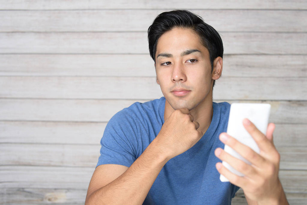 Man looking at smart phone - Photo, Image
