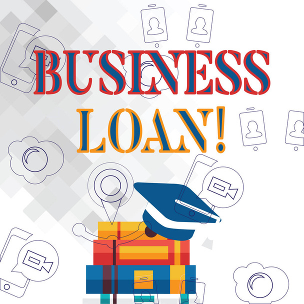 Text sign showing Business Loan. Conceptual photo Loans provided to small businesses for various purposes Graduation Cap with Tassel Resting on Top of Stack of Colorful Thick Books. - Photo, Image