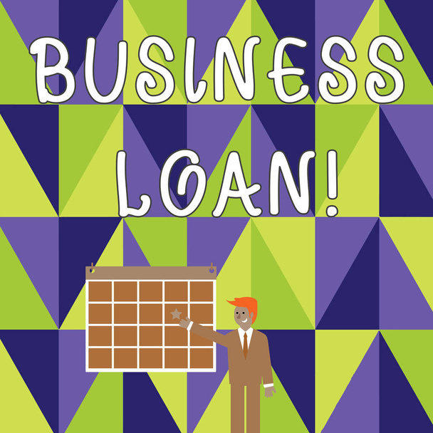 Business Loan 'ı gösteren bir not yazıyorum. Ticari fotoğraf sergisi kredileri küçük işletmelere çeşitli amaçlar için sağlandı İşadamı Gülümseyen ve Wall 'da Star ile İşaret Takvimi. - Fotoğraf, Görsel