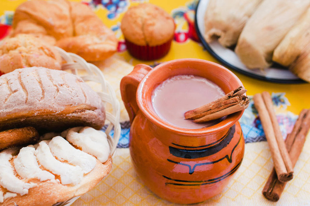 Atole de chocolate, mexican traditional beverage and bread, Made with cinnamon and chocolate in Mexico - Photo, Image