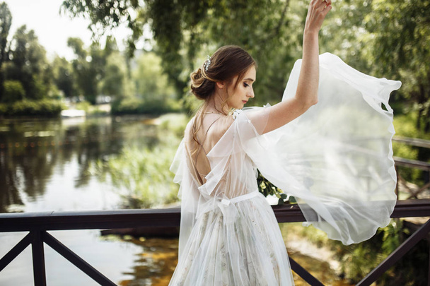 happy beautiful  young bride posing outdoors - Fotoğraf, Görsel