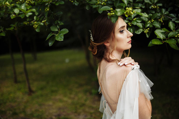 happy beautiful  young bride posing outdoors - Photo, Image
