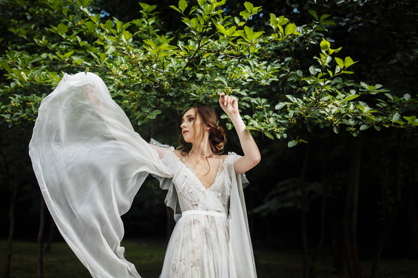 happy beautiful  young bride posing outdoors - Photo, Image