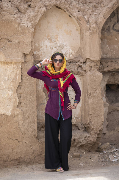 young beautiful Iranian lady in old village in Iran - Photo, Image
