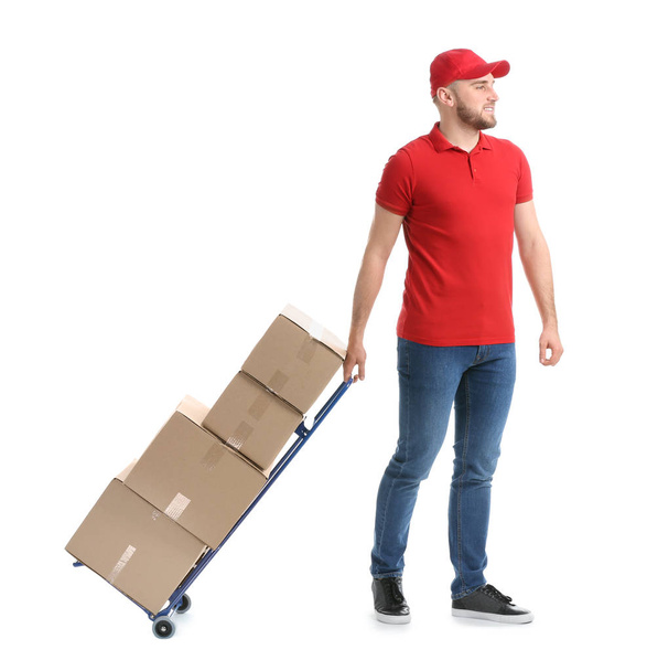 Handsome delivery man with boxes on white background - Photo, Image