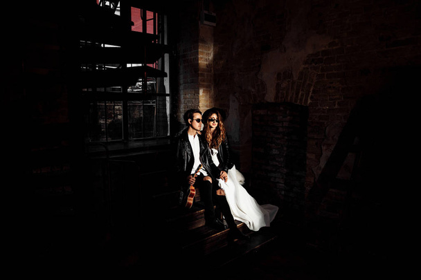 Beautiful young couple  posing in darkness - Фото, изображение