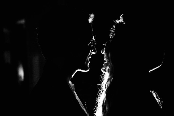Beautiful young couple  kissing  indoors - Foto, afbeelding