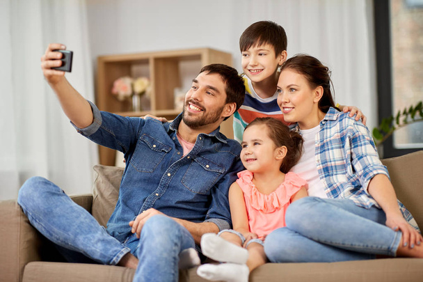 happy family taking selfie at home - Фото, зображення