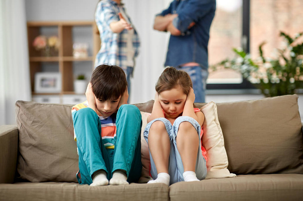 sad children and parents quarreling at home - 写真・画像