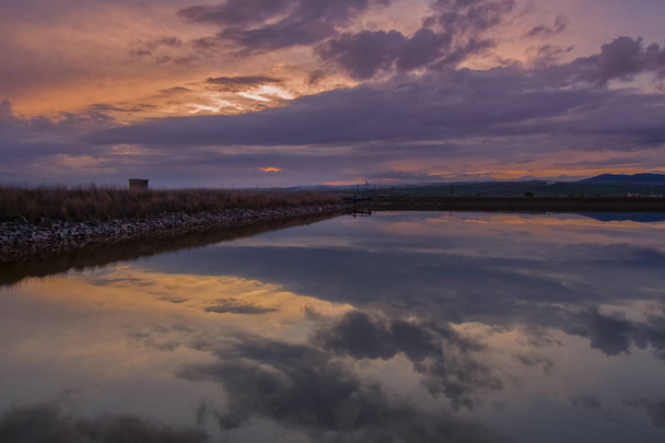 Picturesque landscape with reflections at sunset over the salt-mines in Pomorie resort, Bulgaria. - Photo, Image