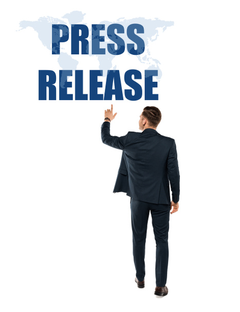 back view of man pointing with finger at press release lettering while standing on white  - Photo, Image