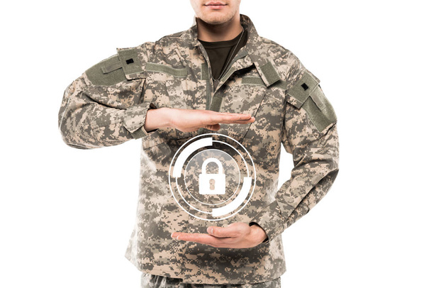 cropped view man in military uniform touching virtual padlock isolated on white  - Valokuva, kuva