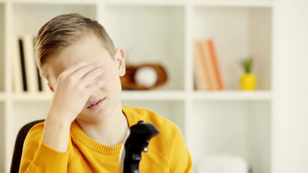 emotional kid holding joystick and becoming upset after playing video game - Filmagem, Vídeo