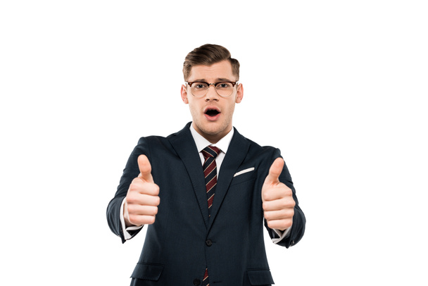 surprised businessman in glasses showing thumbs up isolated on white  - Foto, Imagem
