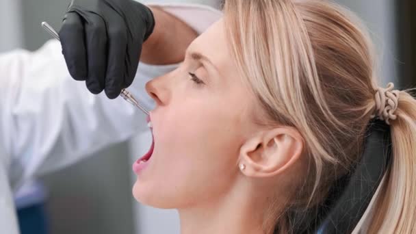 Part of dentist giving woman anesthesia in dentist's clinic - Footage, Video