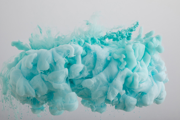 Close up view of blue paint swirls isolated on grey - Φωτογραφία, εικόνα