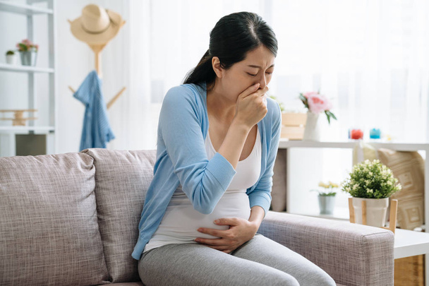 Sick pregnant woman covering mouth cough - Photo, image
