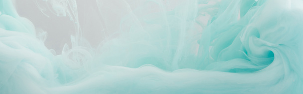 Lähikuva näkymä vaaleansininen maali pyörii vedessä
  - Valokuva, kuva
