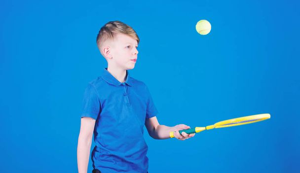 Sport tennis game success. game workout of teen boy. Tennis game player with racket and ball. activity of Llttle boy. Fitness diet brings health and energy. Happy child play tennis. play tennis game - Photo, image
