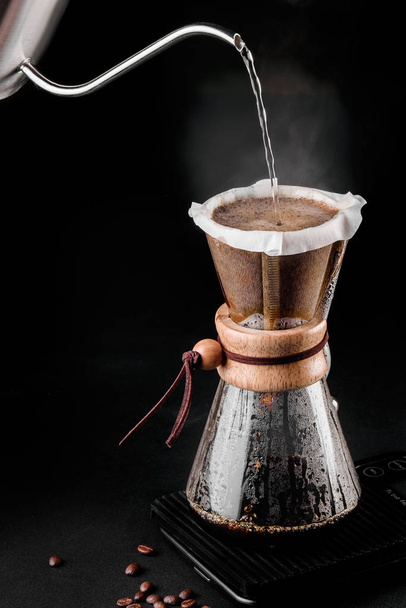 Chemex coffeemaker is a manual pour-over style glass coffeemaker. Chemex is a device for brewing coffee. Coffee brewing - Zdjęcie, obraz