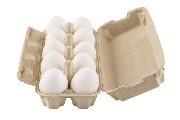 Eggs in an egg carton on a white background. Isolated. - Zdjęcie, obraz